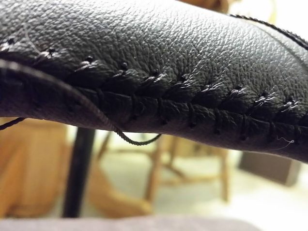 Stitching the steering wheel.